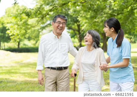 Senior couple rehabilitating and caregiver 66821591