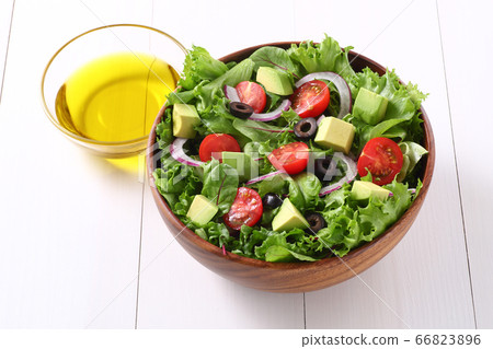 Salad and olive oil 66823896