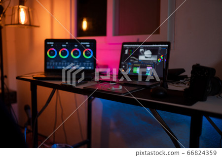 Desk work editor laptop working with video footage 66824359