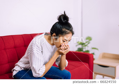 Asian woman coughing with sore throat,Women suffering with cough a lot at home 66824550