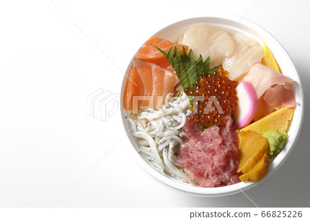 A vivid seafood bowl (white background) with salmon, shirasu, salmon roe, and tuna taken from an overhead view 66825226