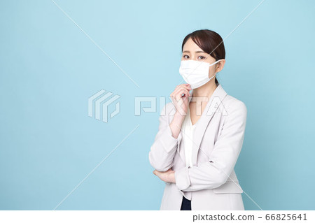 Standing woman wearing a mask Standing woman wearing a mask 66825641