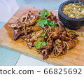 Grilled squid and seafood sauce. 66825692