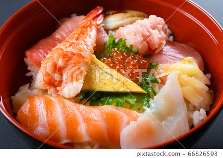 Bowl of rice topped with sashimi Bowl of rice topped with sashimi 66826593