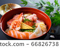Bowl of rice topped with sashimi  66826738