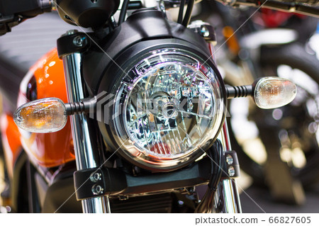 Nonthaburi Thailand:- April 6, 2017: Closeup Detail parts of Headlight "DUCATI Scrambler" Motorcycle Ducati Monster at International Motor Show - Nonthaburi, Thailand Nonthaburi Thailand:- April 6, 2017: Closeup Detail parts of Headlight "DUCATI Scrambler" Motorcycle Ducati Monster at International Motor Show - Nonthaburi, Thailand 66827605