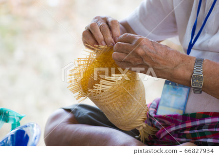 the villagers took bamboo strips to weave into different forms for daily use utensils of the community people in Bangkok Thailand  66827934
