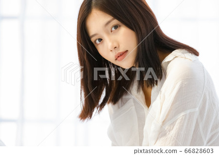 Relaxed young woman in shirt 66828603