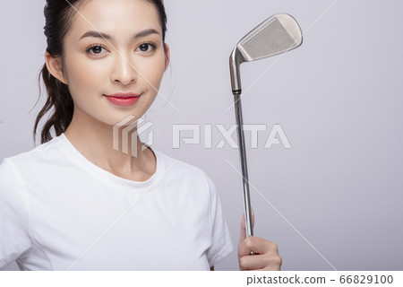 Young women playing golf Young women playing golf 66829100