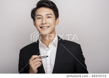 Business portrait of a young man in a suit Business portrait of a young man in a suit 66829318