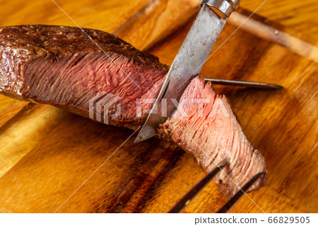 Thick slice of steak to enjoy outdoors Thick slice of steak to enjoy outdoors 66829505