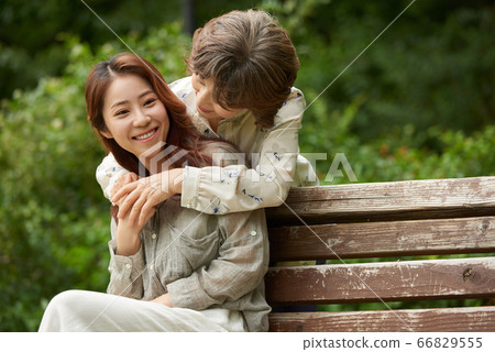 Mother and daughter walking 66829555