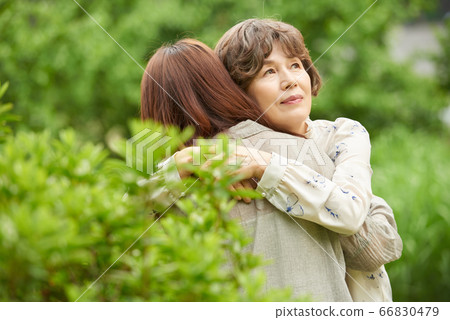 Mother and daughter walking 66830479