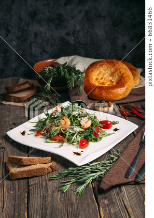 Side view on arugula shrimps and tomatoes salad Side view on arugula shrimps and tomatoes salad 66831466
