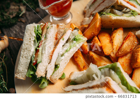 Sandwiches set with red sauce rustic potato wedges 66831713