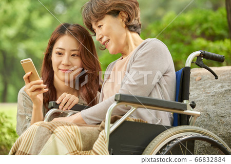 Mother and daughter walking 66832884