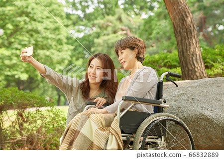 Mother and daughter walking 66832889