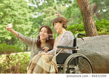 Mother and daughter walking 66832890