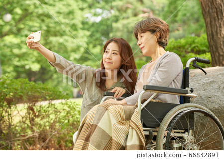 Mother and daughter walking 66832891