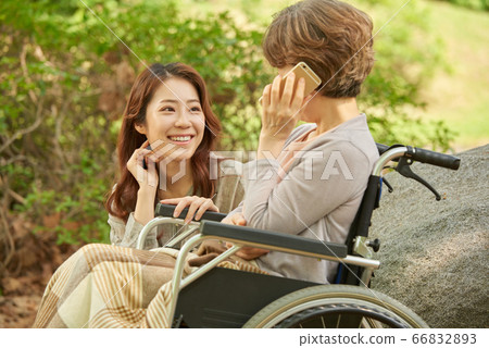 Mother and daughter walking Mother and daughter walking 66832893