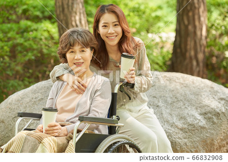 Mother and daughter walking 66832908