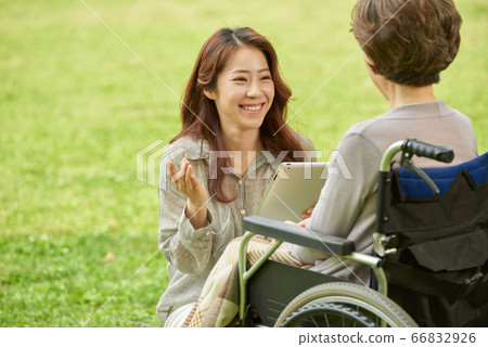 Mother and daughter walking Mother and daughter walking 66832926