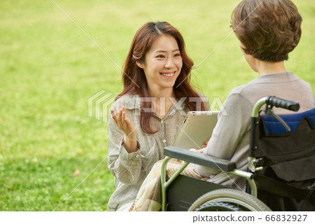 Mother and daughter walking Mother and daughter walking 66832927