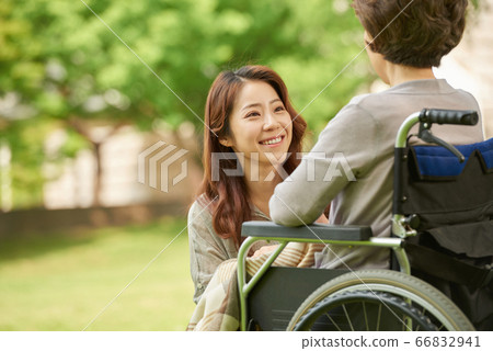 Mother and daughter walking Mother and daughter walking 66832941