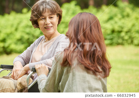 Mother and daughter walking 66832945