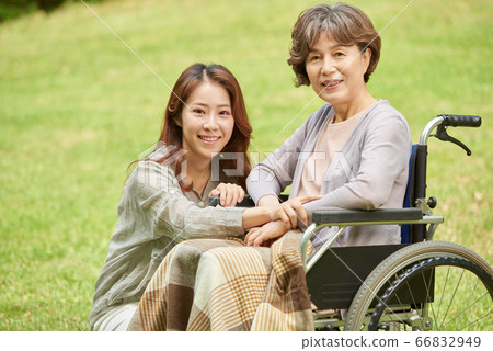 Mother and daughter walking Mother and daughter walking 66832949