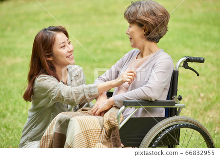 Mother and daughter walking 66832955