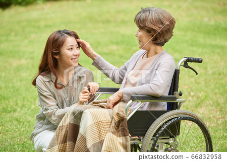 Mother and daughter walking Mother and daughter walking 66832958