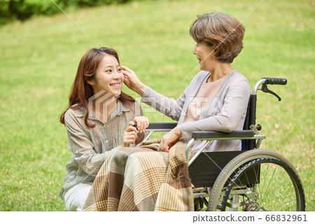 Mother and daughter walking Mother and daughter walking 66832961