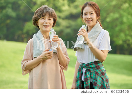 Mother and daughter exercising 66833496