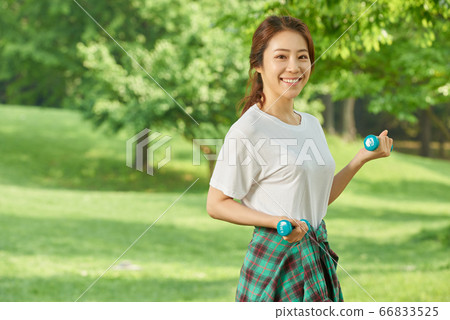 Mother and daughter exercising 66833525