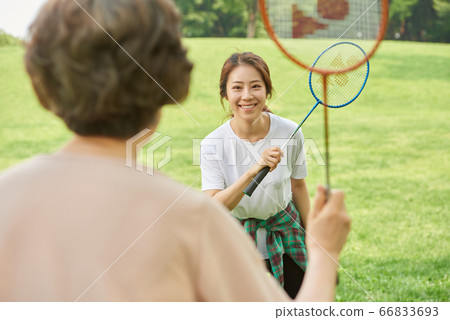 Mother and daughter exercising Mother and daughter exercising 66833693