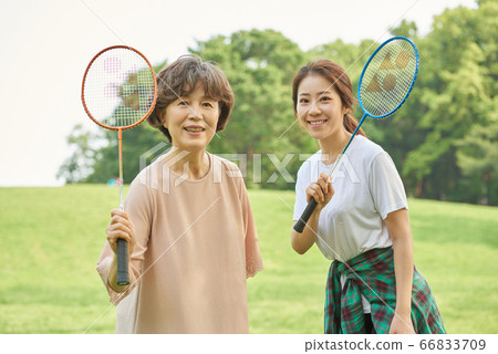 Mother and daughter exercising 66833709