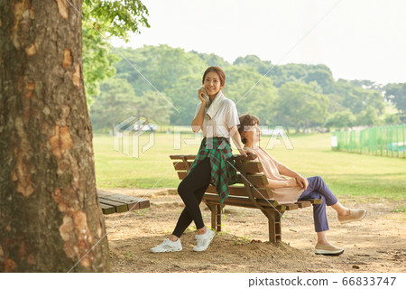 Mother and daughter exercising 66833747