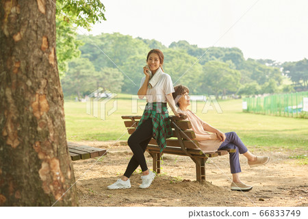 Mother and daughter exercising 66833749