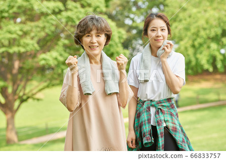 Mother and daughter exercising Mother and daughter exercising 66833757