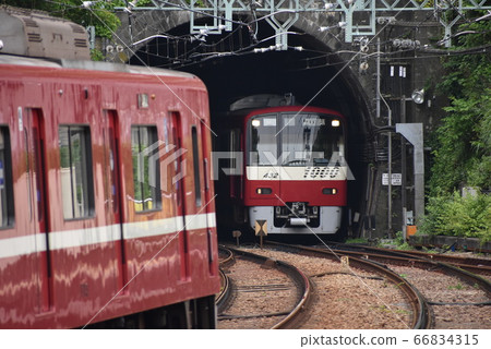 Keikyu Line exiting the tunnel (passing trains) 66834315