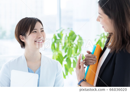 Young woman having a business conversation Young woman having a business conversation 66836020