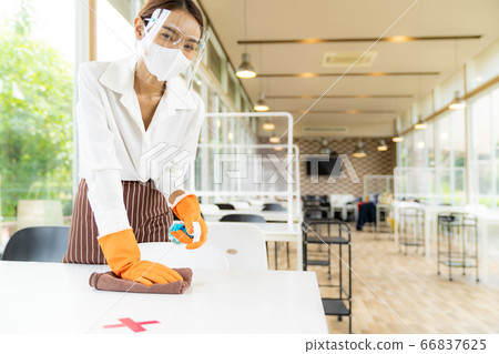 Waitress cleaning table, New Normal Restaurant Waitress cleaning table, New Normal Restaurant 66837625