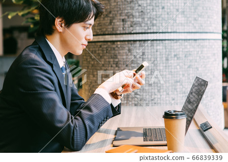 Businessman doing remote work in a shared office Businessman doing remote work in a shared office 66839339