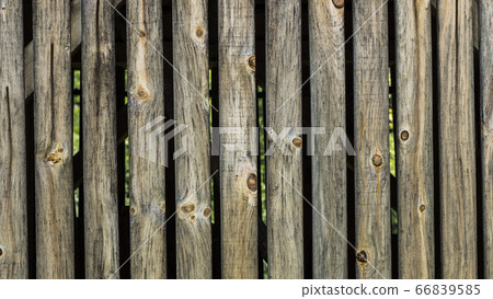 Old wooden fence from vertical boards Old wooden fence from vertical boards 66839585