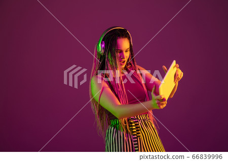Portrait of young caucasian woman on pink background with copyspace, unusual and freaky appearance Portrait of young caucasian woman on pink background with copyspace, unusual and freaky appearance 66839996