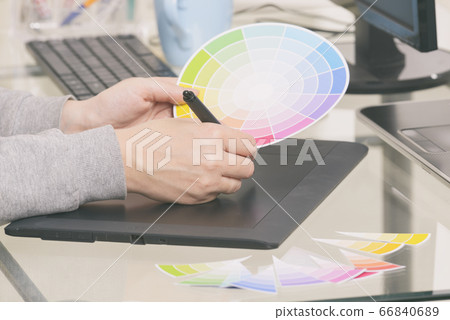 Designer using graphics tablet Designer using graphics tablet 66840689