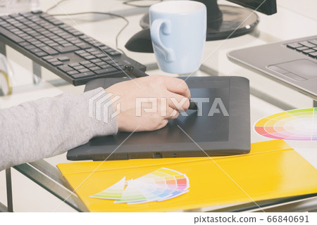 Designer using graphics tablet 66840691