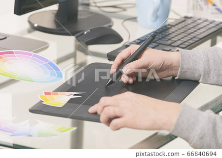 Designer using graphics tablet 66840694