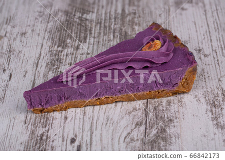 Piece of tart for vegetarians from kuraga and raisins, filled with nut cream and cashews Piece of tart for vegetarians from kuraga and raisins, filled with nut cream and cashews 66842173